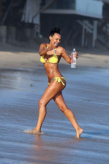 Samantha Mumba sexy in yellow bikini candids