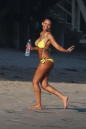 Samantha Mumba sexy in yellow bikini candids