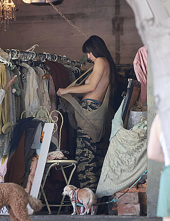 Scout Willis topless while trying on clothes at a store in Los Angeles