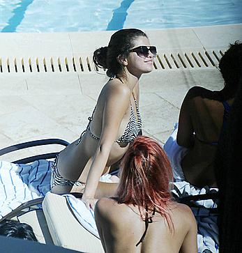 Selena Gomez sexy in bikini at swimming pool in Miami