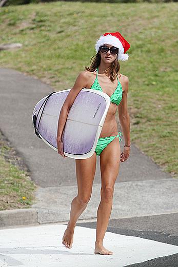 Sharni Vinson in green bikini aerobics on the beach in Sydney