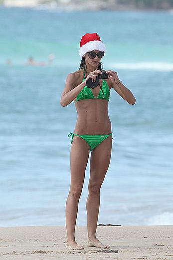 Sharni Vinson in green bikini aerobics on the beach in Sydney