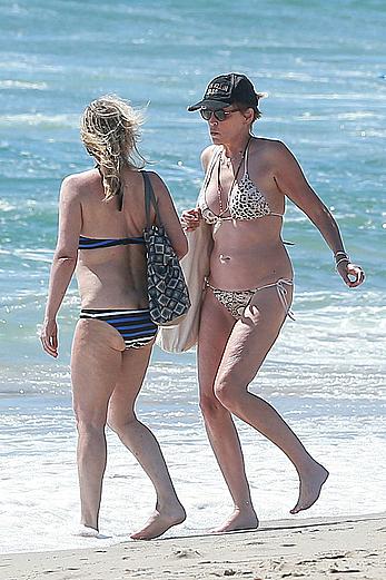 Sharon Stone tit slip in bikini in Venice