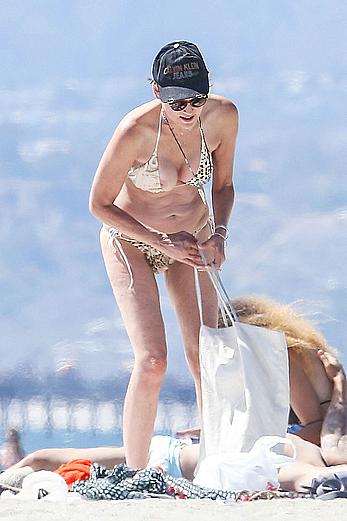 Sharon Stone tit slip in bikini in Venice