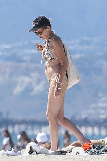 Sharon Stone tit slip in bikini in Venice