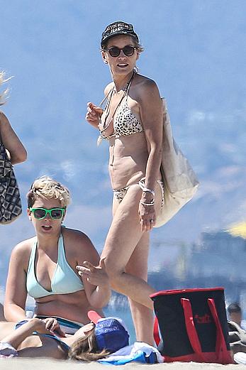 Sharon Stone tit slip in bikini in Venice