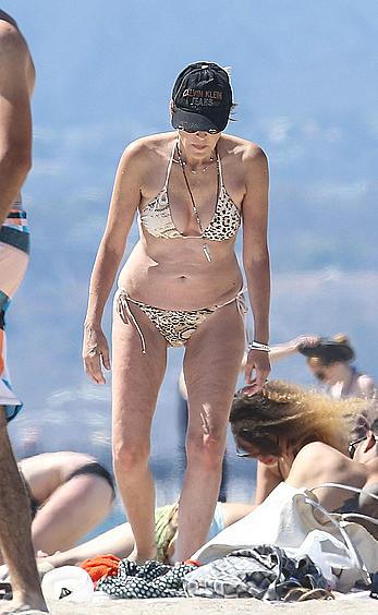 Sharon Stone tit slip in bikini in Venice