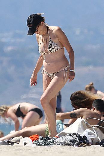 Sharon Stone tit slip in bikini in Venice