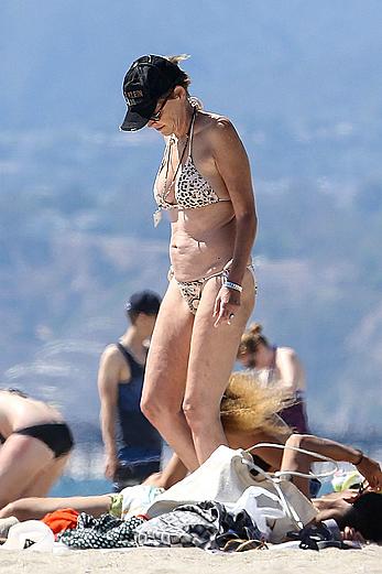 Sharon Stone tit slip in bikini in Venice