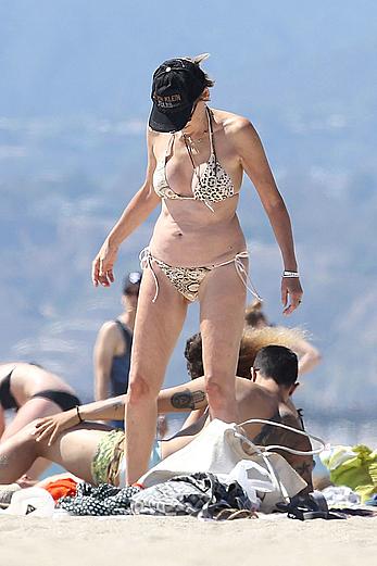 Sharon Stone tit slip in bikini in Venice