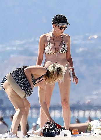 Sharon Stone tit slip in bikini in Venice