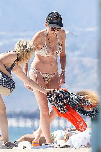 Sharon Stone tit slip in bikini in Venice