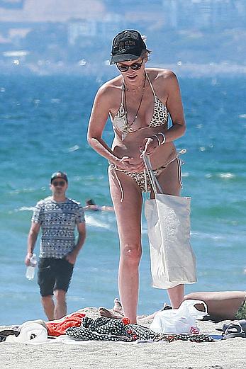 Sharon Stone tit slip in bikini in Venice