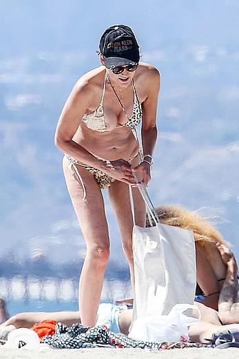 Sharon Stone tit slip in bikini in Venice