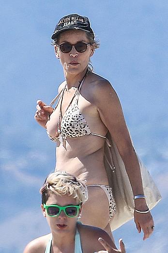 Sharon Stone tit slip in bikini in Venice