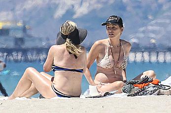 Sharon Stone tit slip in bikini in Venice