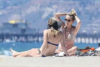 Sharon Stone tit slip in bikini in Venice