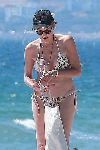 Sharon Stone tit slip in bikini in Venice