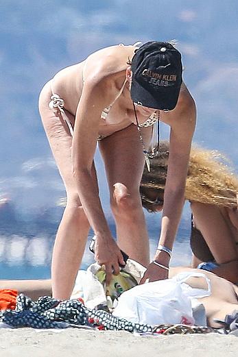 Sharon Stone tit slip in bikini in Venice