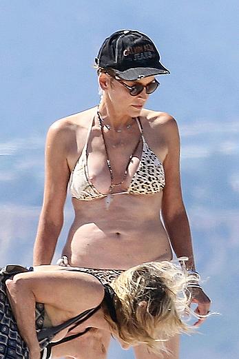 Sharon Stone tit slip in bikini in Venice