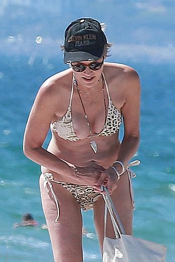 Sharon Stone tit slip in bikini in Venice