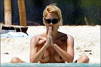 Sharon Stone topless on a beach in red bikini panties paparazzi photos