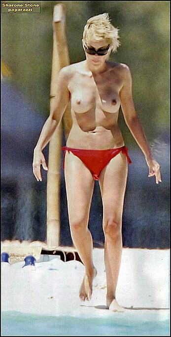 Sharon Stone topless on a beach in red bikini panties paparazzi photos