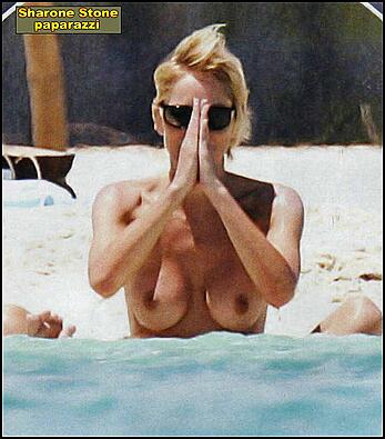 Sharon Stone topless on a beach in red bikini panties paparazzi photos