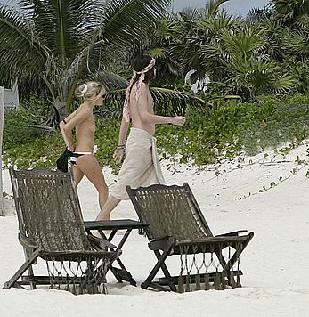 Sienna Miller sunbathing topless on the beach candids