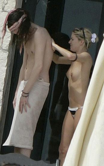 Sienna Miller sunbathing topless on the beach candids