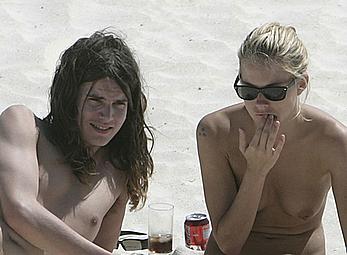 Sienna Miller sunbathing topless on the beach candids