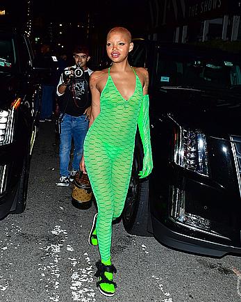 Slick Woods braless in lime green see through one-piece following Rihanna’s Fenty after party in New York