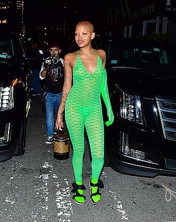 Slick Woods braless in lime green see through one-piece following Rihanna’s Fenty after party in New York