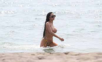 Busty Soraja Vucelic goes topless to show her boobs at a beach