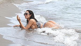 Busty Soraja Vucelic goes topless to show her boobs at a beach