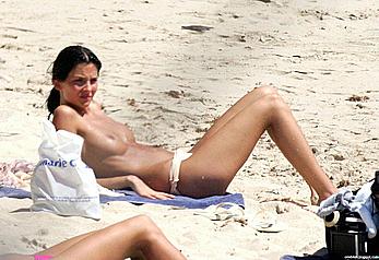 Stanimira Koleva swimming and sunbathing topless