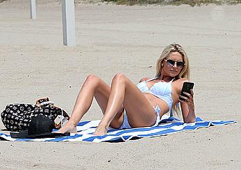 Stephanie Pratt in white bikini on a beach