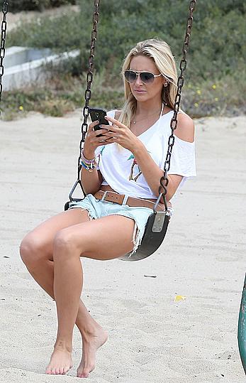 Stephanie Pratt in white bikini on a beach