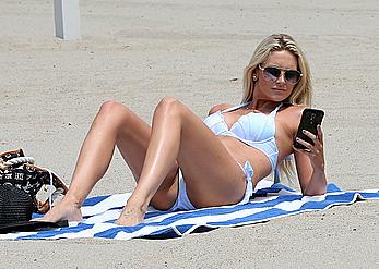 Stephanie Pratt in white bikini on a beach