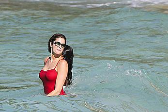 Stephanie Seymour sexy in red tight monokini on the beach in St. Barts