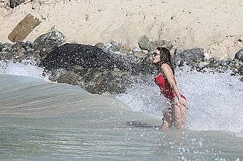 Stephanie Seymour sexy in red tight monokini on the beach in St. Barts