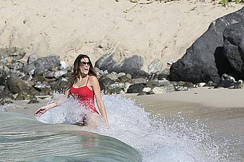 Stephanie Seymour sexy in red tight monokini on the beach in St. Barts