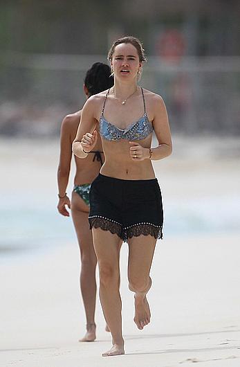 Suki Waterhouse jogging on the beach in Mexico