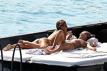 Tania Cagnotto sunbathing topless on a boat