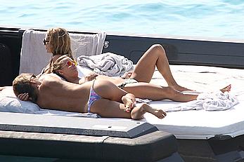 Tania Cagnotto sunbathing topless on a boat