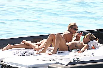 Tania Cagnotto sunbathing topless on a boat