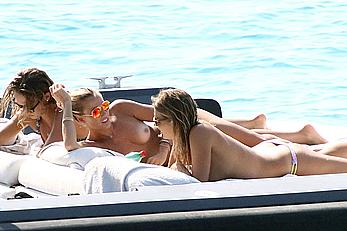 Tania Cagnotto sunbathing topless on a boat