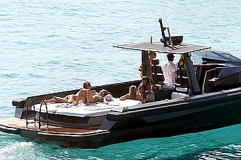 Tania Cagnotto sunbathing topless on a boat