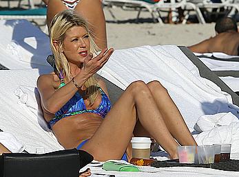 Tara Reid cleavage and cameltoe in bikini in Miami