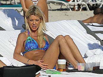 Tara Reid cleavage and cameltoe in bikini in Miami